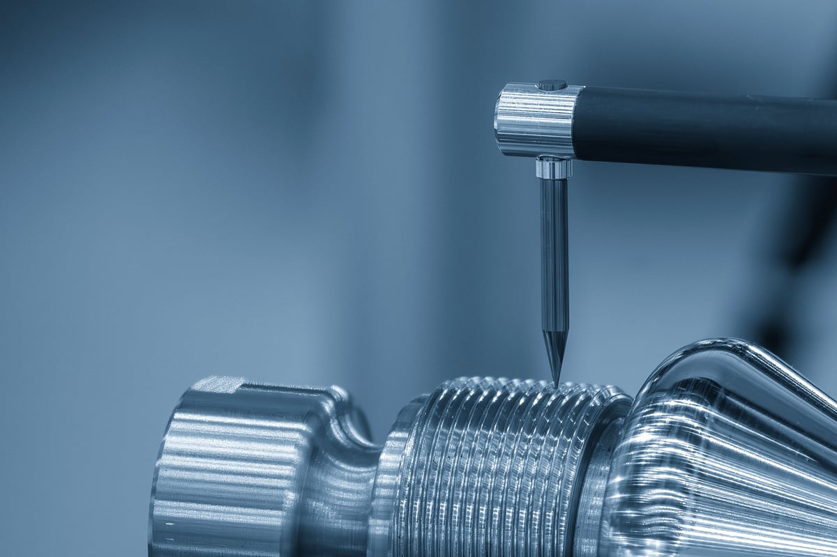 The metrology inspection process, specifically the measurement of surface roughness of threads on bolts or screws.